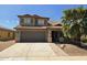 Inviting home with a tile roof, two-car garage, and a mature palm tree in the front yard at 42435 W Desert Fairways Dr, Maricopa, AZ 85138