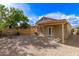 Beautiful backyard featuring a covered patio and a soothing water fountain at 4387 E Hartford Ave, Phoenix, AZ 85032