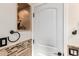 Elegant bathroom featuring decorative tile, a shelf inset, and modern fixtures for a luxurious feel at 4387 E Hartford Ave, Phoenix, AZ 85032