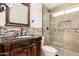 Beautiful bathroom featuring a glass shower and ornate vanity at 4387 E Hartford Ave, Phoenix, AZ 85032