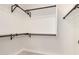 Walk-in closet boasts custom shelves, providing ample space for organized clothing and storage solutions at 4387 E Hartford Ave, Phoenix, AZ 85032