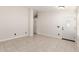 Spacious room featuring tile flooring, neutral walls, and a modern ceiling fan at 4387 E Hartford Ave, Phoenix, AZ 85032