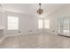 Spacious living room with tile flooring and abundant natural light with views of the backyard at 4387 E Hartford Ave, Phoenix, AZ 85032