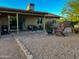 Cozy backyard features a covered patio, a fire pit, and ample seating for outdoor enjoyment at 4901 W Corrine Dr, Glendale, AZ 85304
