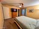 Cozy bedroom features a television on a dresser, a window with blinds, carpeted floors, and a ceiling fan at 4901 W Corrine Dr, Glendale, AZ 85304