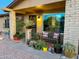 Inviting front porch decorated with potted plants and outdoor seating, creating a cozy ambiance at 4901 W Corrine Dr, Glendale, AZ 85304
