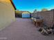 Side yard features gravel ground covering, a shed, and a garden planter box at 4901 W Corrine Dr, Glendale, AZ 85304