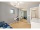 Bedroom has a mirror closet and a small desk, creating a cozy and productive space at 514 N 112Th Dr, Avondale, AZ 85323