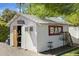 Backyard -shed featuring a bar area with an open door, disc golf, and external bar sign at 5320 E Thomas Rd, Phoenix, AZ 85018