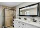 Modern bathroom featuring dual sinks, a spacious shower, and stylish fixtures at 5320 E Thomas Rd, Phoenix, AZ 85018