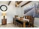 Cozy dining room with a wooden table, decorative lighting, and stylish wall art at 5320 E Thomas Rd, Phoenix, AZ 85018