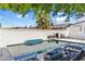Refreshing backyard pool with lounge chairs, patio, and privacy wall is an entertainer's dream at 5320 E Thomas Rd, Phoenix, AZ 85018