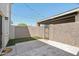 This lovely backyard offers hardscape, string lights, a small patch of grass, and privacy at 610 E Montebello Ave # 46, Phoenix, AZ 85012