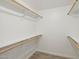 Bright, spacious walk-in closet with shelving and hardwood floors at 610 E Montebello Ave # 46, Phoenix, AZ 85012