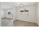 Bright dining room featuring hardwood floors, a window offering natural light, and a modern pendant light fixture at 610 E Montebello Ave # 46, Phoenix, AZ 85012