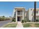 Two-story condo featuring a well-manicured lawn, mature trees, and a private balcony at 610 E Montebello Ave # 46, Phoenix, AZ 85012
