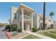 Two-story condo featuring a well-manicured lawn, mature trees, and a private balcony at 610 E Montebello Ave # 46, Phoenix, AZ 85012