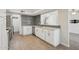 Modern kitchen featuring white cabinets, updated appliances, sleek countertops, and decorative backsplash for a modern touch at 610 E Montebello Ave # 46, Phoenix, AZ 85012
