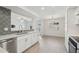 Modern kitchen featuring white cabinets, updated appliances, sleek countertops, and decorative backsplash for a modern touch at 610 E Montebello Ave # 46, Phoenix, AZ 85012