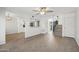 Open-concept living room with wood laminate flooring, a view of the kitchen, and access to the staircase at 610 E Montebello Ave # 46, Phoenix, AZ 85012