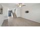 Living room featuring wood laminate flooring, a ceiling fan, and a view to the staircase and entrance at 610 E Montebello Ave # 46, Phoenix, AZ 85012