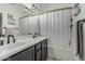 Bathroom features a double sink vanity with modern fixtures and a shower-tub combination at 6940 E Cochise Rd # 1027, Paradise Valley, AZ 85253
