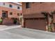 Attached garage with a private driveway and meticulously landscaped entrance at 6940 E Cochise Rd # 1027, Paradise Valley, AZ 85253