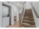 Hallway with adjacent in-unit washer/dryer and stairway to the next level at 6940 E Cochise Rd # 1027, Paradise Valley, AZ 85253