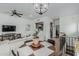 Open-concept living and dining area with hardwood floors and kitchen view at 6940 E Cochise Rd # 1027, Paradise Valley, AZ 85253