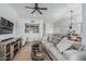Spacious living room featuring hardwood floors and an opening to the kitchen area at 6940 E Cochise Rd # 1027, Paradise Valley, AZ 85253