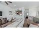 Cozy living room featuring hardwood floors with an opening to the kitchen and a view of the bedroom at 6940 E Cochise Rd # 1027, Paradise Valley, AZ 85253