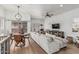 Open-concept living room featuring hardwood floors and a dining area at 6940 E Cochise Rd # 1027, Paradise Valley, AZ 85253
