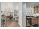 Inviting living space with wood floors seamlessly connects the kitchen, dining, and living areas at 6940 E Cochise Rd # 1027, Paradise Valley, AZ 85253