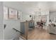 Open living space with wood floors, stairway, and modern decor leading to a dining area at 6940 E Cochise Rd # 1027, Paradise Valley, AZ 85253