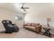 Well-lit bedroom featuring a massage chair, sofa, and a cozy atmosphere at 735 E Northern Ave, Phoenix, AZ 85020