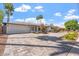 A beautiful single-story home featuring a wide driveway and manicured landscaping at 735 E Northern Ave, Phoenix, AZ 85020
