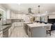 Spacious kitchen with an island, stainless steel appliances, and decorative lighting at 735 E Northern Ave, Phoenix, AZ 85020