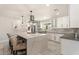 Modern kitchen with a large island, stylish pendant lighting, and stainless steel appliances at 735 E Northern Ave, Phoenix, AZ 85020