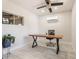Minimalist office space featuring a sleek desk, ceiling fan, and natural light at 735 E Northern Ave, Phoenix, AZ 85020