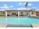 Backyard showcasing a sparkling pool, comfortable seating, and a covered patio perfect for outdoor entertaining at 735 E Northern Ave, Phoenix, AZ 85020