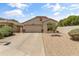 Charming single-story home featuring desert landscaping, a two-car garage, and a welcoming entrance at 812 S Fern Ct, Gilbert, AZ 85296