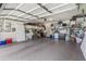Spacious two-car garage with epoxy flooring, shelving, and ample storage space for vehicles and organizational needs at 812 S Fern Ct, Gilbert, AZ 85296