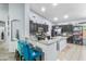 Open kitchen featuring bar seating, granite countertops, dark cabinets, and stainless steel appliances at 812 S Fern Ct, Gilbert, AZ 85296