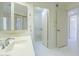 Well-lit bathroom featuring a vanity with modern fixtures, white cabinets, and a shower with glass doors at 839 S Westwood -- # 170, Mesa, AZ 85210