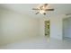 Bedroom featuring tile floors, ceiling fan, and a view into the bathroom with vanity and mirror at 839 S Westwood -- # 170, Mesa, AZ 85210