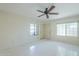 Bedroom featuring tile flooring, multiple windows, and ample space at 839 S Westwood -- # 170, Mesa, AZ 85210