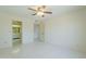 Bright bedroom features tile floors, ceiling fan, and access to a bathroom and closet space at 839 S Westwood -- # 170, Mesa, AZ 85210