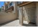 Exterior shot featuring a covered entryway with security screen door and a private patio area at 839 S Westwood -- # 170, Mesa, AZ 85210