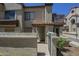 Inviting condo exterior with a private courtyard and gate, offering a cozy and secure entrance at 839 S Westwood -- # 170, Mesa, AZ 85210