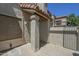 Exterior view showing stucco facade, private patio area, and a gated entryway at 839 S Westwood -- # 170, Mesa, AZ 85210